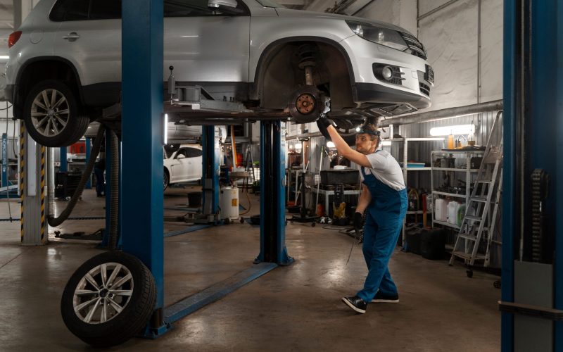 male-mechanic-working-shop-car (1)